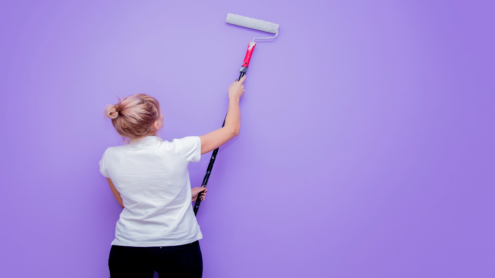 woman-with-paint-roller-in-own-house-try-to-paint
